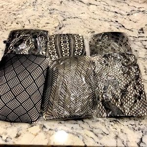 6 pairs multi-design, full-length fishnet stockings. Sold as a set.